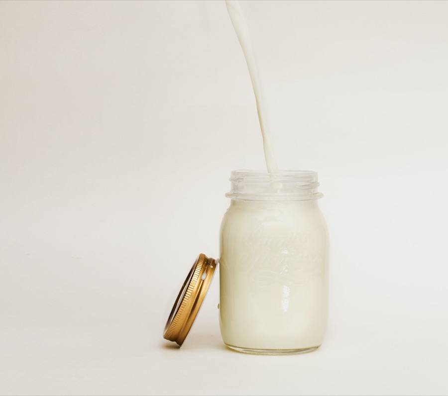 Glass of milk on table