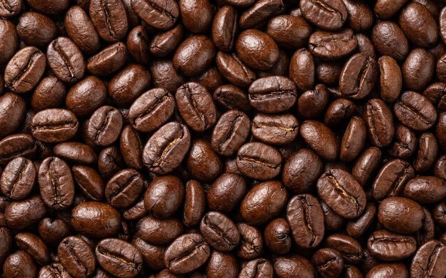 Roasted coffee beans filling the frame