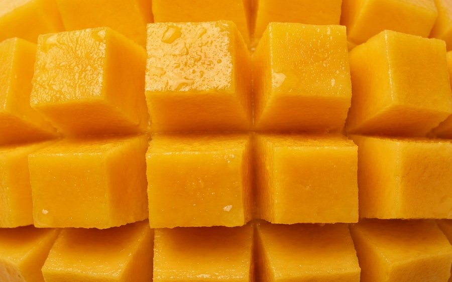 Cubed ripe mango filling the frame